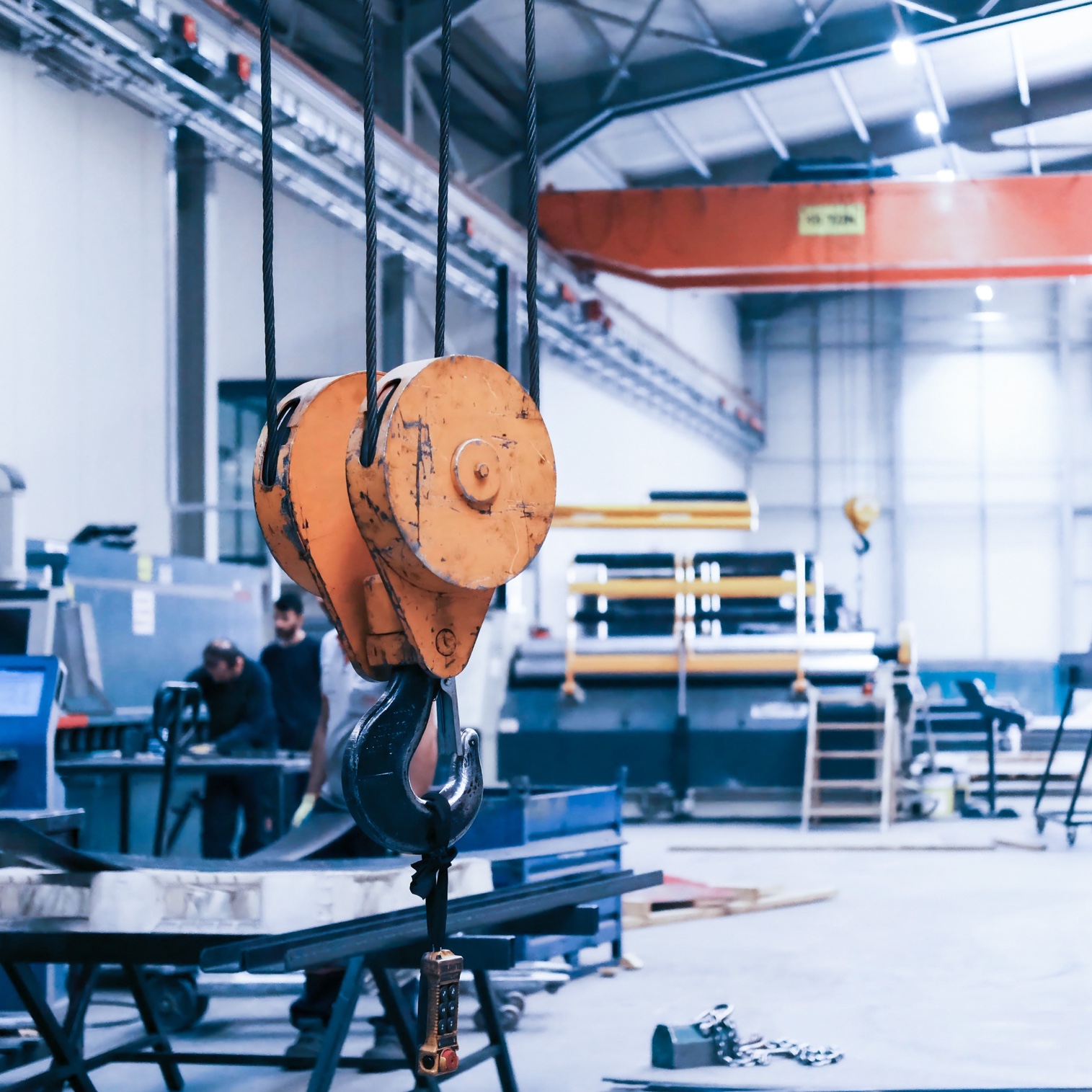 Overhead crane hook inside a steel processing facility