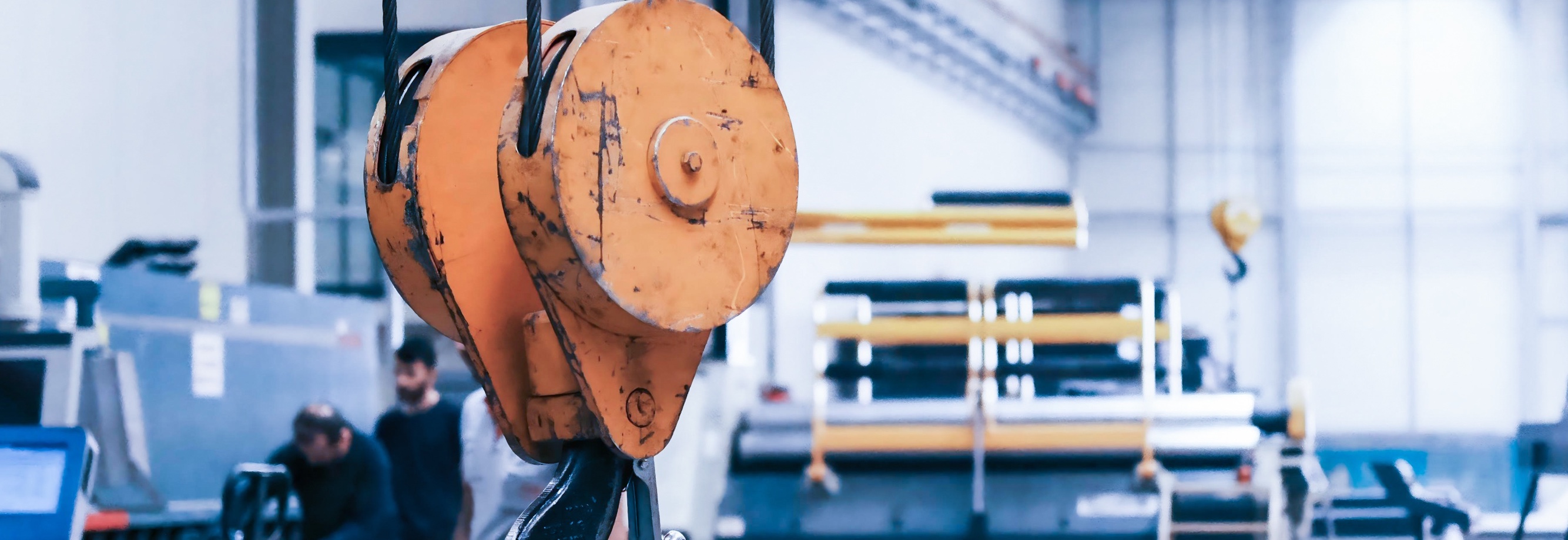 Overhead crane hook inside a steel processing facility